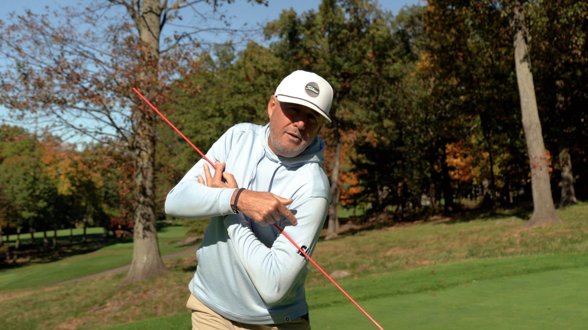 Use this alignment stick drill to help tilt shoulders correctly