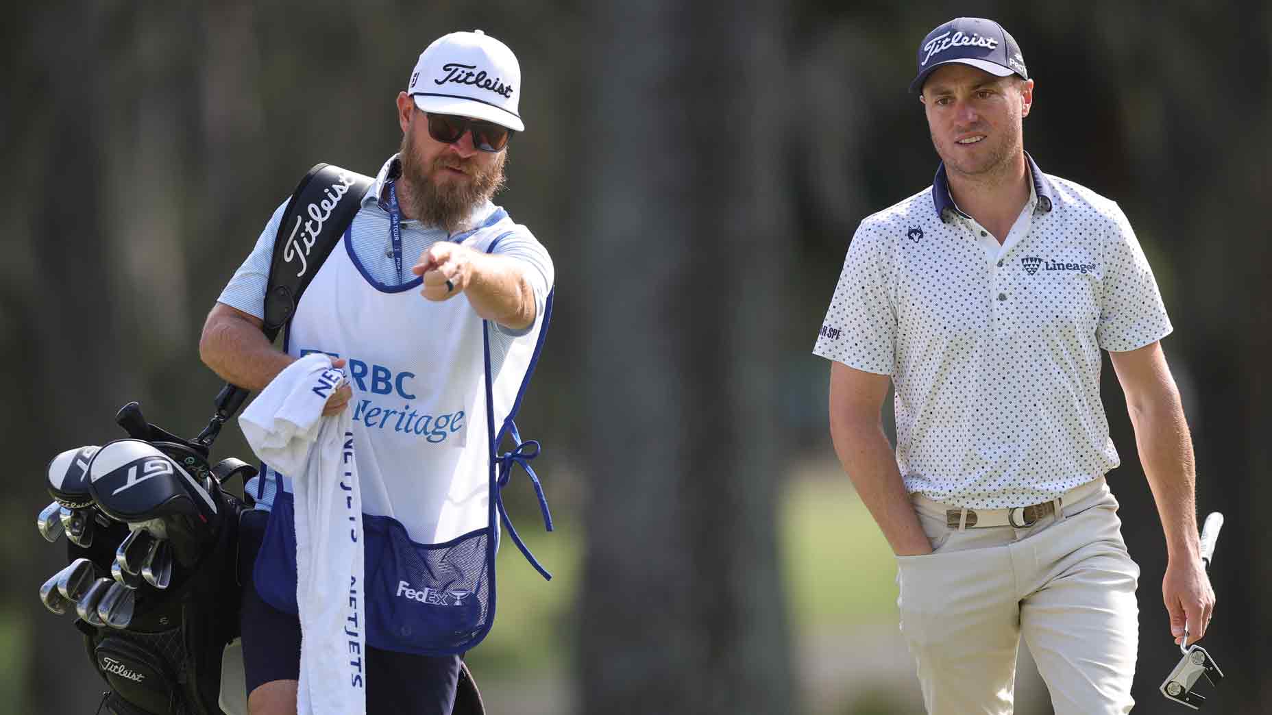 Justin Thomas of the United States and his caddie, Joe Greiner, walk on the 15th green during the second round of the RBC Heritage 2025 at Harbour Town Golf Links on April 18, 2025 in Hilton Head Island, South Carolina.