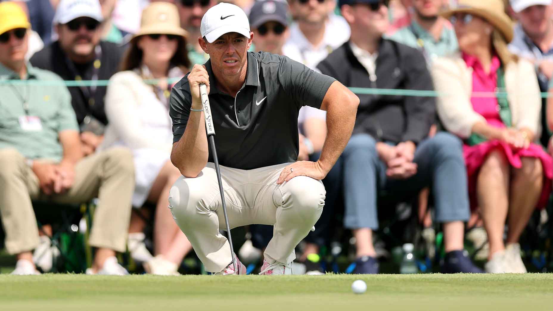 rory mcilroy reads a putt during the second round of the 2025 masters