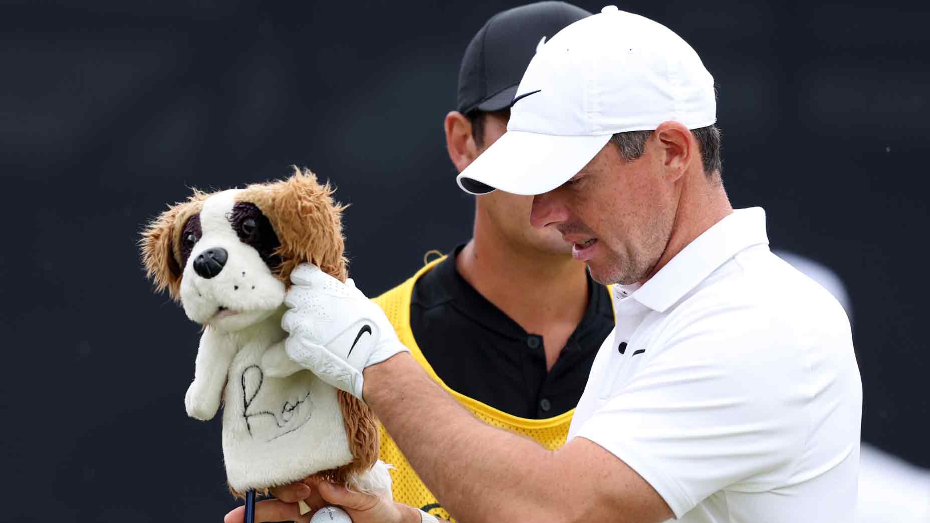 Rory McIlroy of Northern Ireland removes the Dog Driver Head Cover as they prepare to tee off on the 1st hole on Day Three of The 151st Open at Royal Liverpool Golf Club on July 22, 2023 in Hoylake, England.