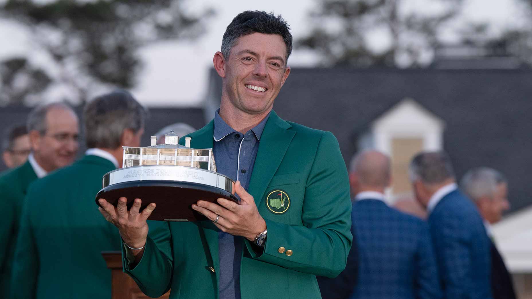Rory McIlroy poses with the Masters trophy after winning his first green jacket on Sunday night at Augusta National Golf Club.