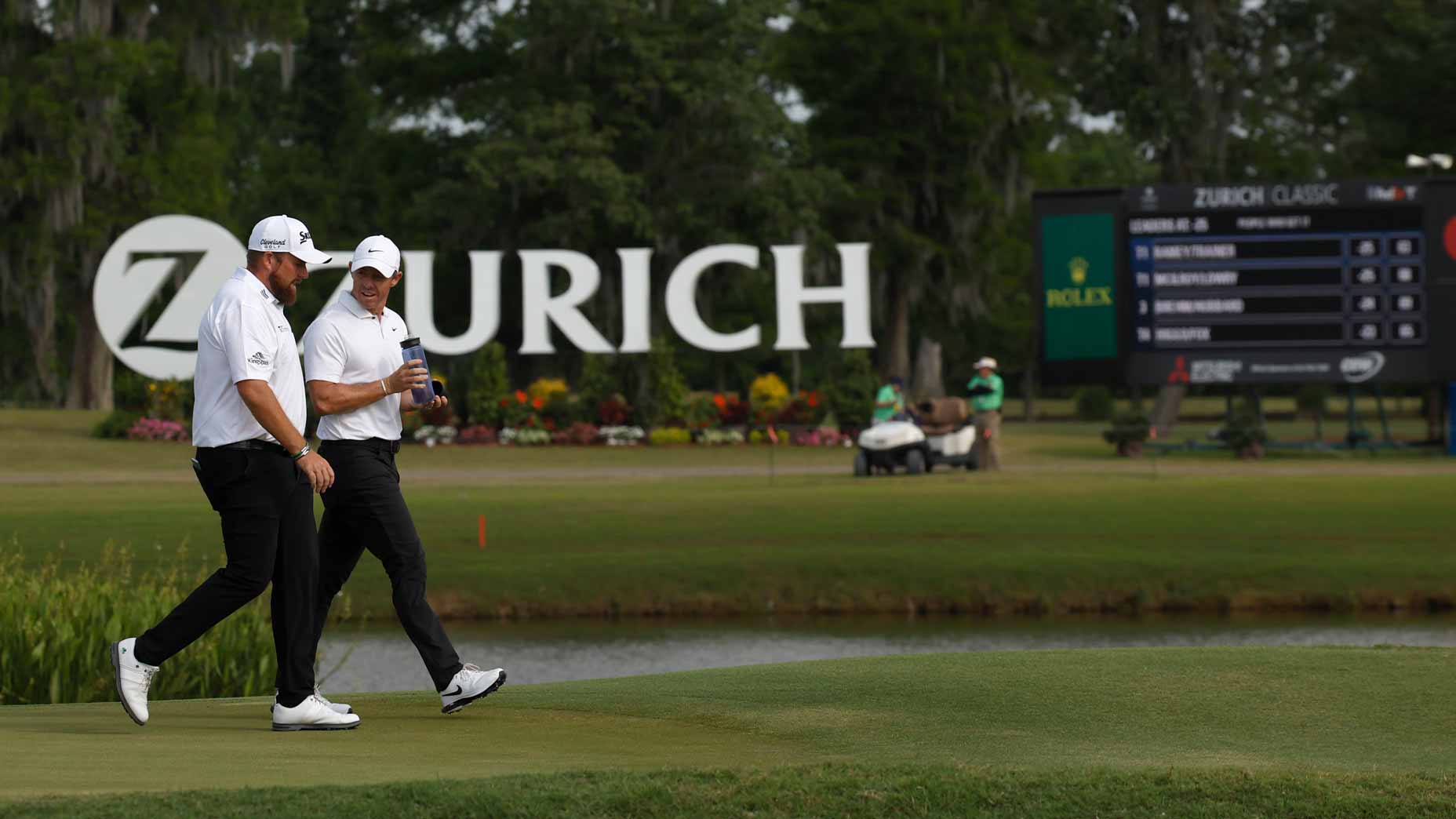 2025 Zurich Classic tee times: Shane Lowry and Rory McIlroy walk to the first playoff hole during the final round of the Zurich Classic of New Orleans.